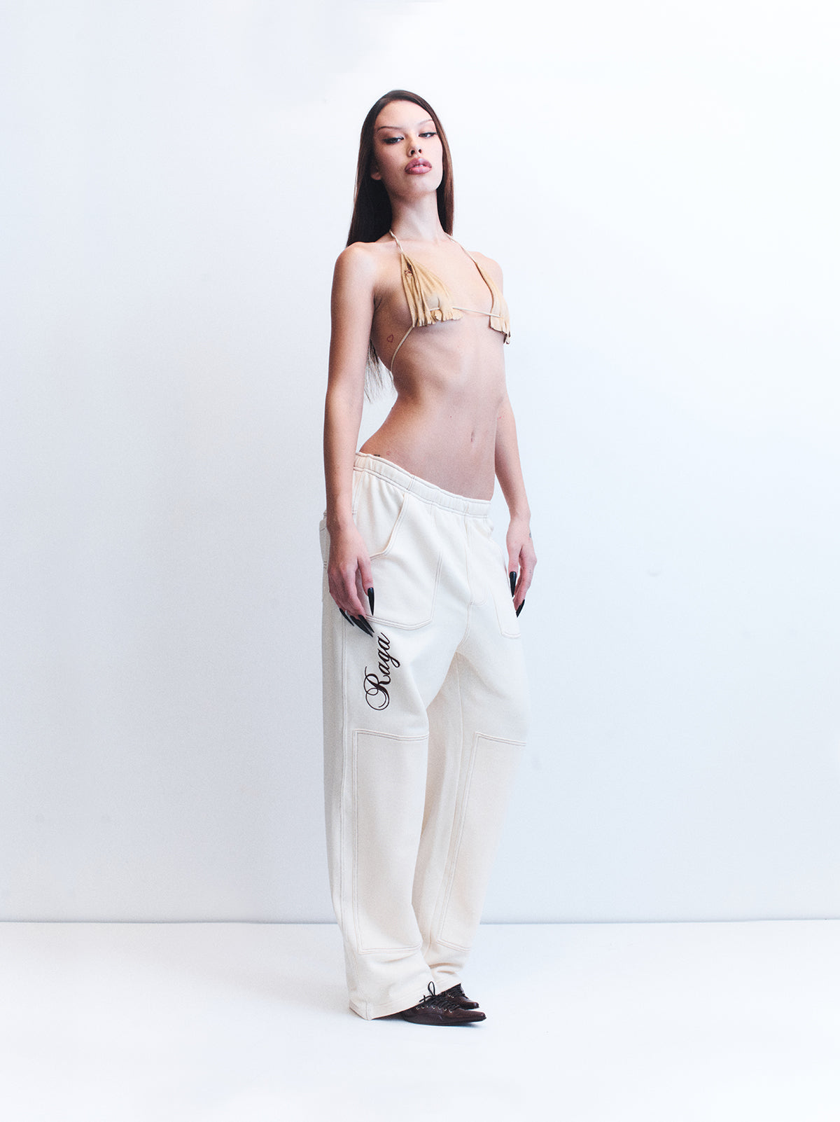 8. NINO CREAM TRACK PANTS