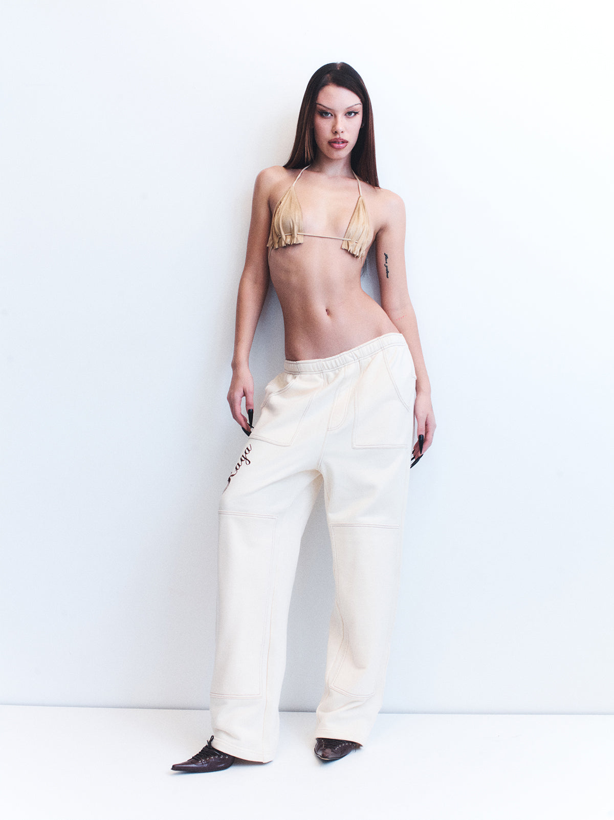 8. NINO CREAM TRACK PANTS